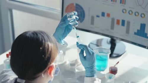 In the Laboratory a Scientist Demonstrates Precision in Biochemistry and Biology Research By