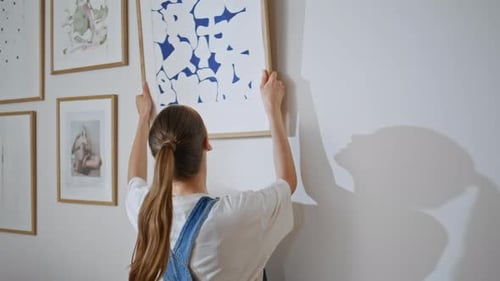 Woman Hanging Art Print on White Wall