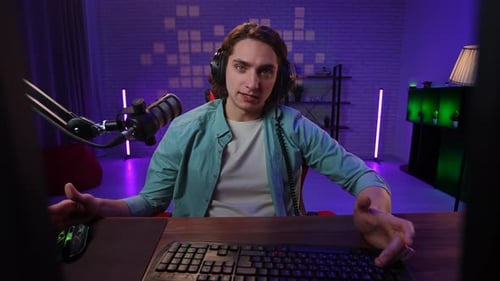Young Adult Streamer Waving and Talking to Camera