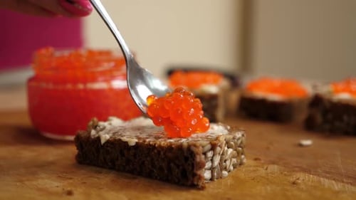 Preparing Salmon Roe Appetizer on Bread