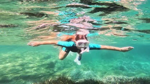Woman Swims in the Clean Water of Sardinia