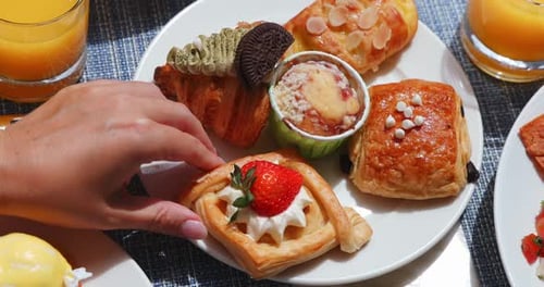 Pastries, croissant, and juice on table at brunch