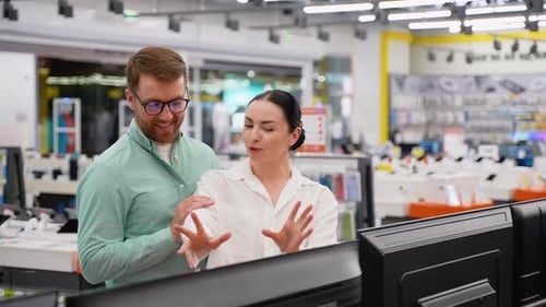 Young Couple Buying New Tv at Tech Store for New Home Looking for a New Smart TV