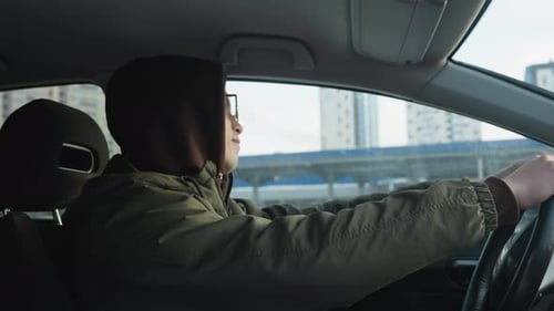 Side View Man Dancing in Parked Car Hands on Steering Wheel