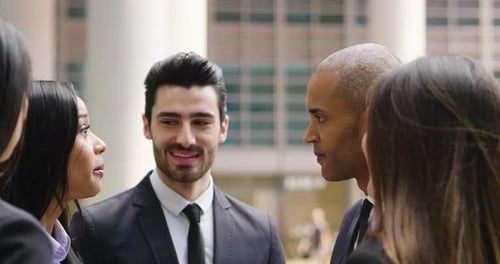 Diverse Business Team Meeting Near Modern Office