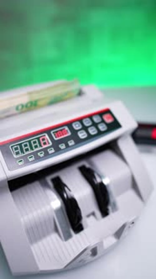 Money Counter Counting Euro Banknotes on Counter