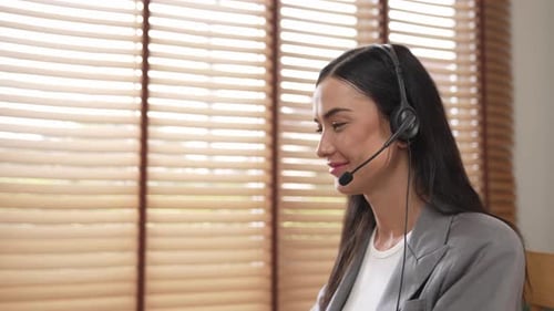 Female call center operator or customer service helpdesk staff. Blithe