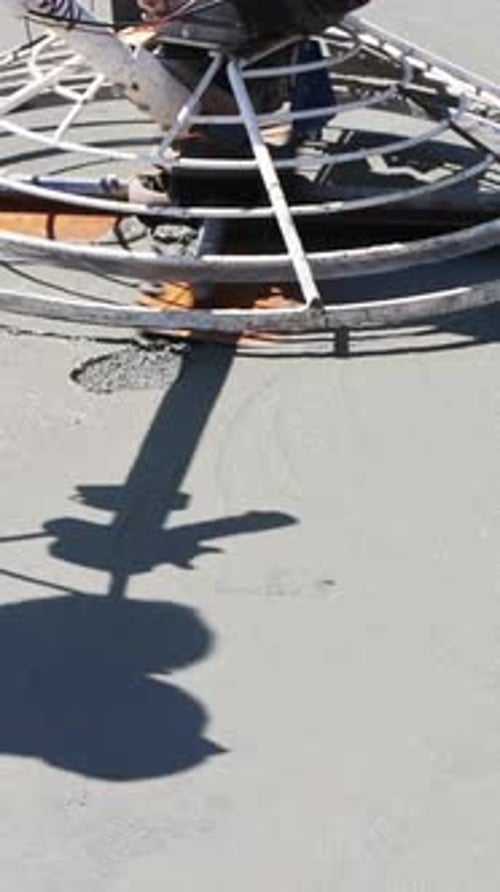 Concrete Slab Finishing Equipment Preparing Smooth Surface at Construction Site