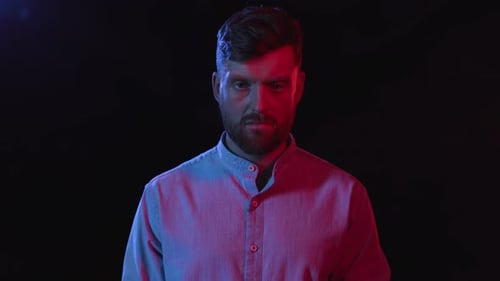 Man in shirt zooms in, screams, looks scared