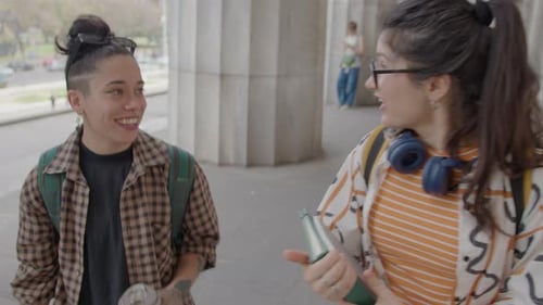 Two Female Friends Walking and Talking after Study Day at University