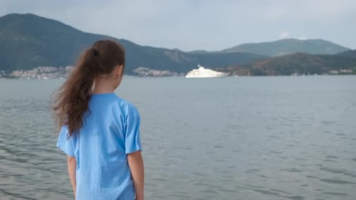 Lonely Child Against Sea Bay