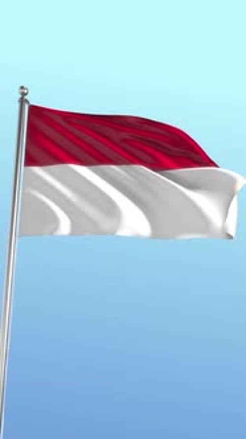 Indonesia Flag Waving on Pole Against Clear Blue Sky