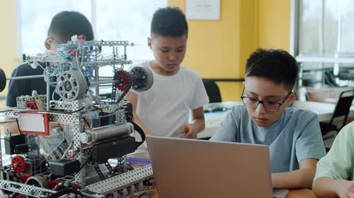 Children Collaborate on Robotics Project in Classroom