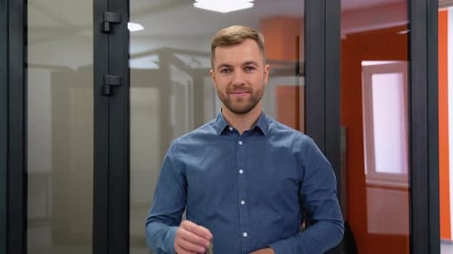 Friendly Seller in Window Shop with Keys