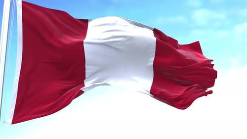 Waving Flag of Peru Against Blue Sky