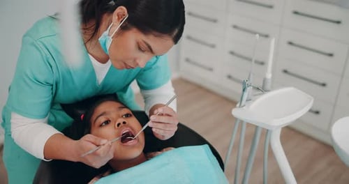 Child Receiving Dental Checkup in Bright Office
