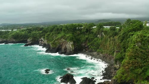 Seogwipo rocky coastline aerial view, Jeju Island, South Korea