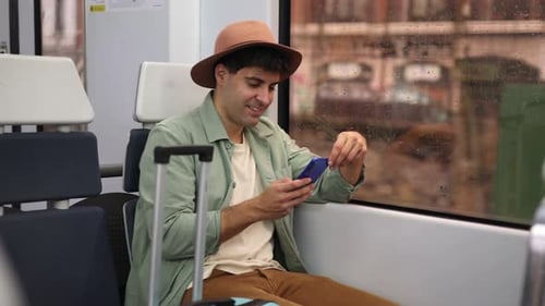 Happy traveler texting arrival at destination station on train, 4k video