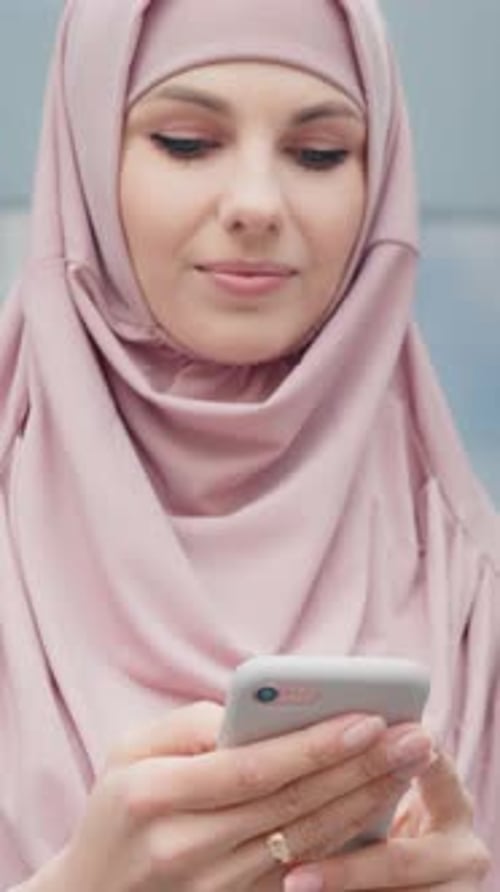 Vertical Screen Low Angle View of Beautiful Muslim Woman Standing Near Modern
