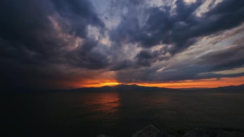 Beautiful sunset on the lake . a red sunset on the sea or a large lake.time-lapse sun sets behind a