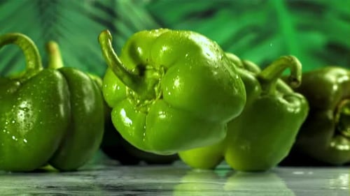 Green Sweet Pepper Falls on a Wet Board Filmed on a Highspeed Camera at 1000 Fps