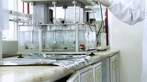 Lab Equipment Mixing Liquids During Scientific Research