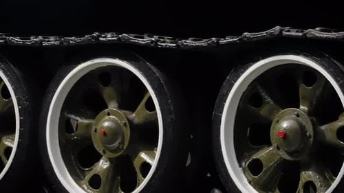 Detailed Closeup Footage Capturing the Wheels Track and Mechanical Components of a Large Armored