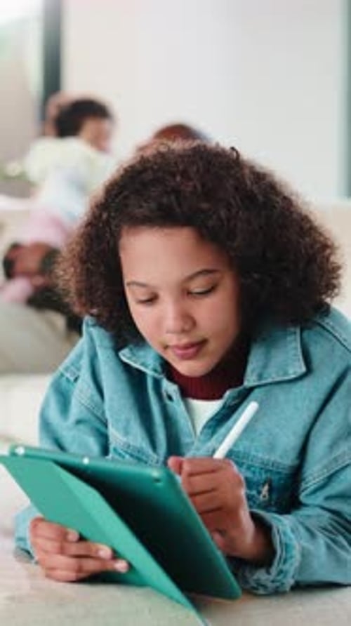 Child, writing and elearning with tablet in home, growth or skill development with assignment
