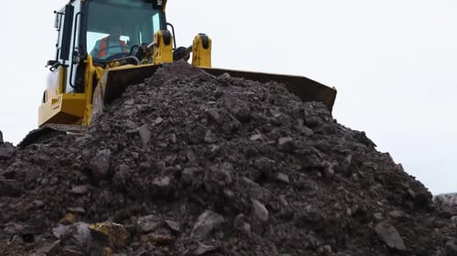 Bulldozer Moves Dirt on Construction Site