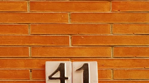 Number 41 (forty-one) Affixed to a Building