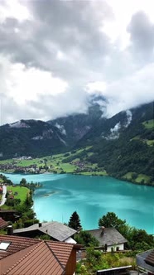 Beautiful Alpine Landscape with Blue Lake and Green Hills