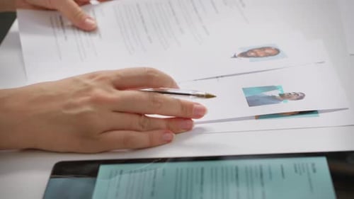 Team of Recruiters Selecting Candidates Based on Their Resumes