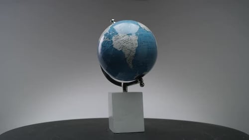 wide shot of a globe in a studio
