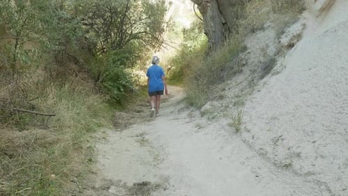 Woman enjoys outdoor solitude peaceful meditative nature walk exercise