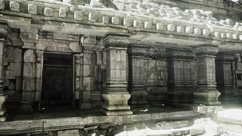 Ancient Stone Temple Entrance in Cambodia Surrounded By Lush Greenery