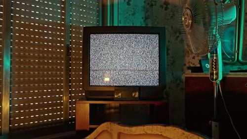 Vintage Television with Static in Dark Room