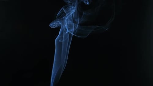 Rising Wisps of Smoke Against Black