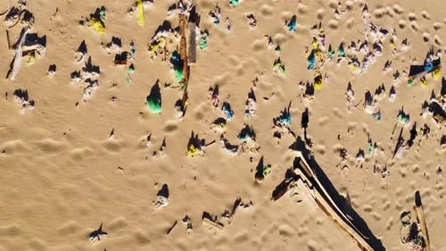 Beach pollution, tropical shore contaminated by plastic garbage, aerial top down