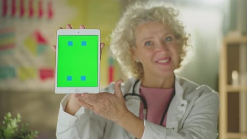 Doctor showing tablet vertically