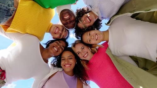 Low Angle View of Diverse Group of Young Women Hugging Each Other Outdoors