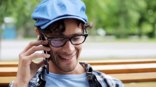 Man with Glasses Talking on Phone While Outdoors