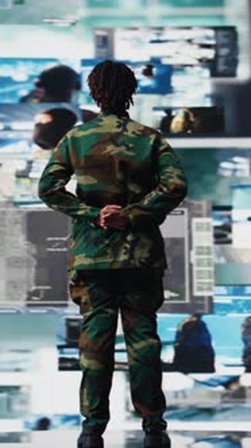 Vertical Video Military Officer Oversees Mission Control on Digital Display