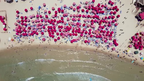 Mediterranean beach during summer with people in the water