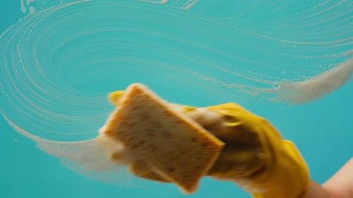 Cleaning Service Close Up of Woman Cleaning Table at Home with Spray Homework Clean of Ditry Kitchen