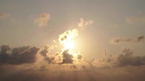 Golden Sun Rising Through Clouds Time Lapse