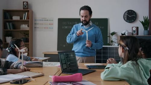 Teacher Explains Wind Turbine to Attentive Class