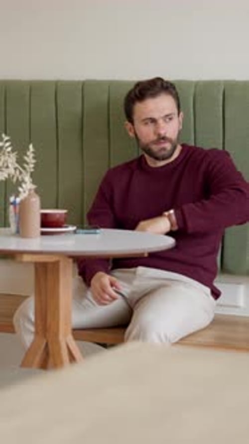 Man, watch and check time at cafe for business meeting, client delay or late for appointment