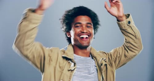 Joyful Young Man Dancing and Celebrating