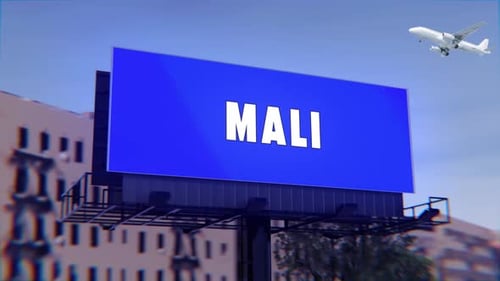 Mali Road Sign With A Street Billboard And An Airplane Taking Off In The Background