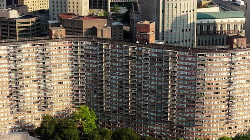 Aerial View of Manhattan's Bustling Skyline Featuring 1960s Apartment Building and Lush Green Spaces